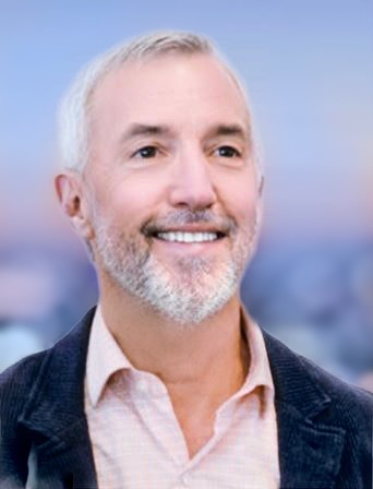 A head shot of a man smiling